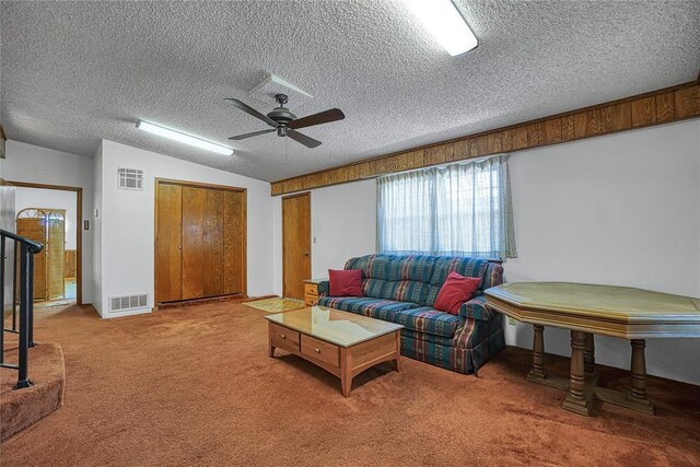 1909 N Flamingo Ln, Altus, OK 73521 - carpeted living room featuring a ceiling fan, a textured ceiling, and baseboards