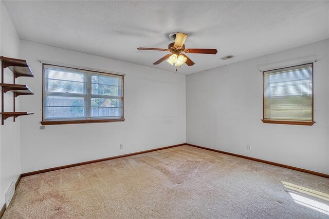 1909 N Flamingo Ln, Altus, OK 73521 - carpeted empty room with baseboards and ceiling fan
