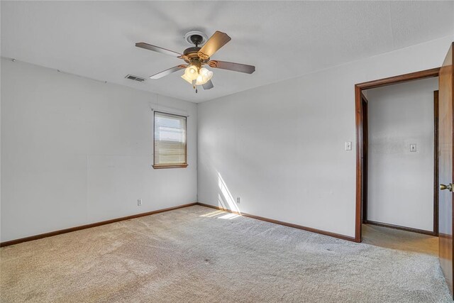 1909 N Flamingo Ln, Altus, OK 73521 - carpeted spare room with baseboards and ceiling fan