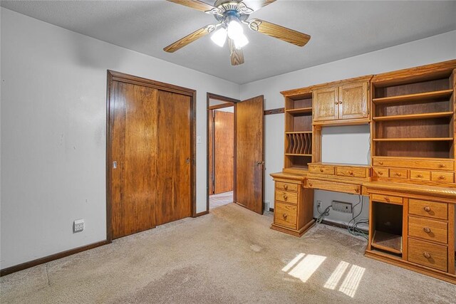 1909 N Flamingo Ln, Altus, OK 73521 - unfurnished office featuring light carpet, ceiling fan, and baseboards