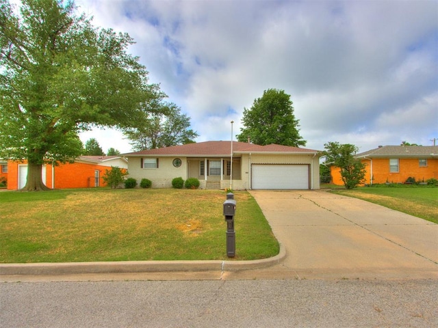 1505 W Blake St, El Reno, OK 73036 - single story home with a garage, driveway, and a front yard