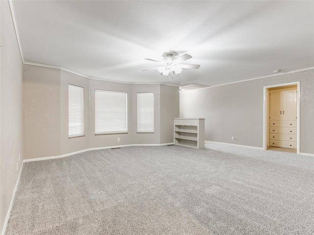 1505 W Blake St, El Reno, OK 73036 - carpeted empty room featuring crown molding, a ceiling fan, and baseboards
