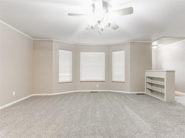 1505 W Blake St, El Reno, OK 73036 - unfurnished living room with ornamental molding, carpet floors, baseboards, and a ceiling fan