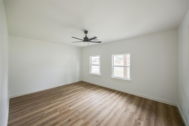 2817 N Donnelly Ave, Oklahoma City, OK 73107 - empty room with wood finished floors, baseboards, and a ceiling fan