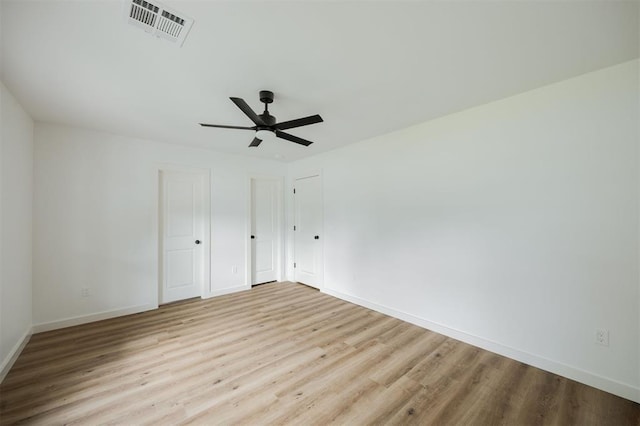 2817 N Donnelly Ave, Oklahoma City, OK 73107 - unfurnished bedroom with wood finished floors, baseboards, and a ceiling fan