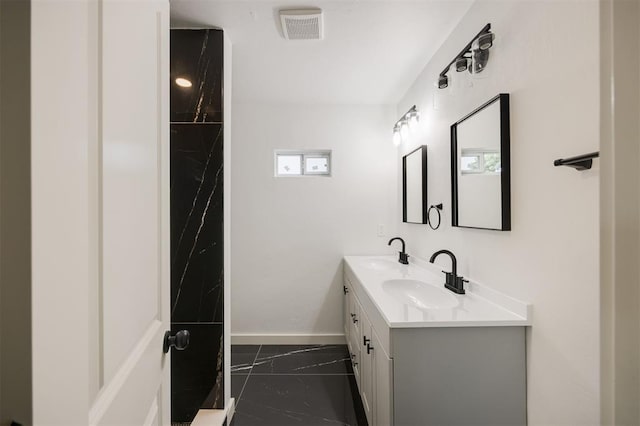 2817 N Donnelly Ave, Oklahoma City, OK 73107 - bathroom with double vanity, baseboards, and marble finish flooring