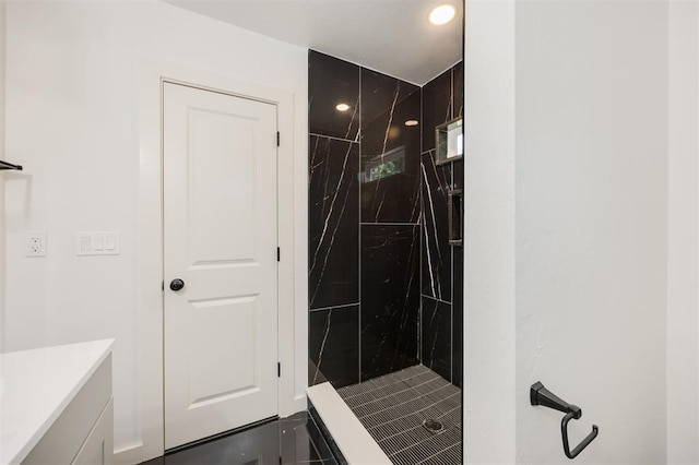2817 N Donnelly Ave, Oklahoma City, OK 73107 - bathroom featuring a marble finish shower, vanity, and recessed lighting