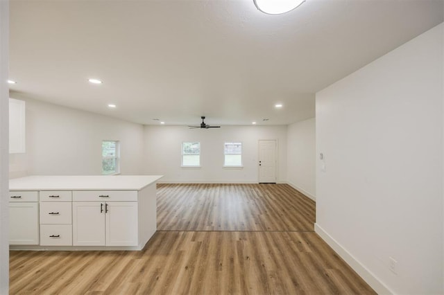 2817 N Donnelly Ave, Oklahoma City, OK 73107 - spare room with light wood-style flooring, baseboards, a ceiling fan, and recessed lighting