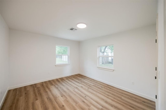2817 N Donnelly Ave, Oklahoma City, OK 73107 - empty room featuring plenty of natural light, light wood-type flooring, and baseboards