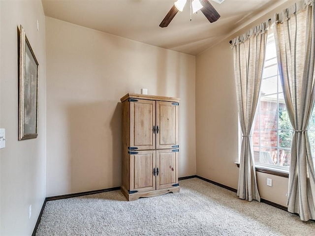 12275 Autumn Brk, Guthrie, OK 73044 - unfurnished bedroom featuring light colored carpet, baseboards, and ceiling fan