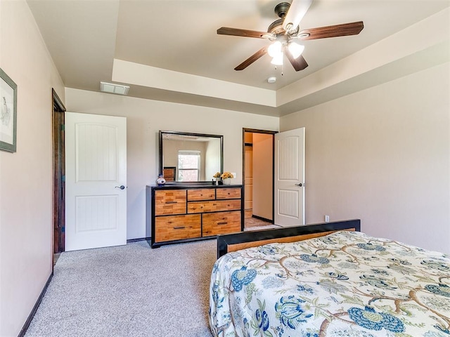 12275 Autumn Brk, Guthrie, OK 73044 - carpeted bedroom with baseboards, ceiling fan, and a raised ceiling