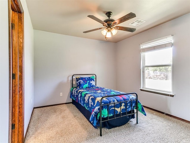 12275 Autumn Brk, Guthrie, OK 73044 - carpeted bedroom with baseboards and a ceiling fan