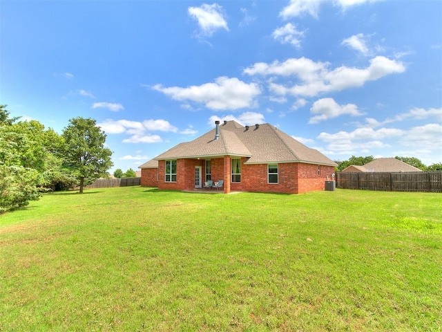12275 Autumn Brk, Guthrie, OK 73044 - back of property featuring cooling unit and brick siding