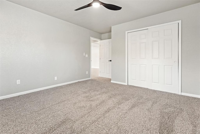 701 Iowa St, Norman, OK 73069 - unfurnished bedroom featuring carpet flooring, baseboards, a closet, and ceiling fan