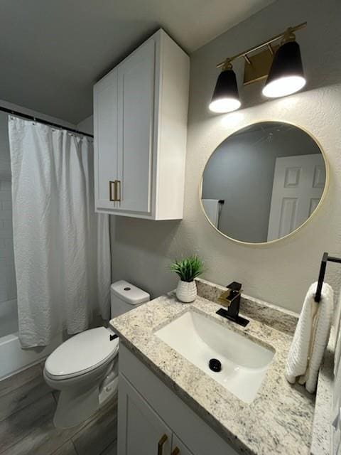 701 Iowa St, Norman, OK 73069 - bathroom with vanity, toilet, and shower / bath combo with shower curtain