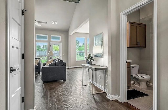 3921 Bandera Trl, Norman, OK 73071 - corridor featuring dark wood-style flooring, baseboards, and vaulted ceiling