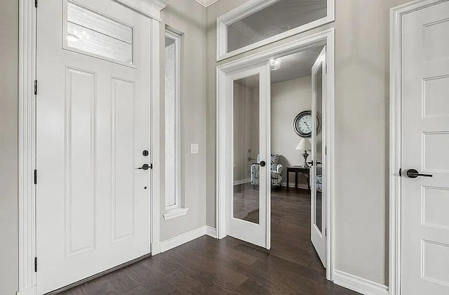 3921 Bandera Trl, Norman, OK 73071 - entryway featuring french doors, dark wood-style flooring, and baseboards