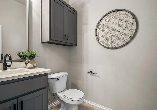 3921 Bandera Trl, Norman, OK 73071 - bathroom with toilet, vanity, and baseboards