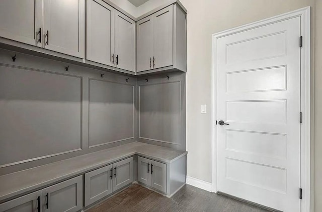 3921 Bandera Trl, Norman, OK 73071 - mudroom with dark wood-style floors and baseboards