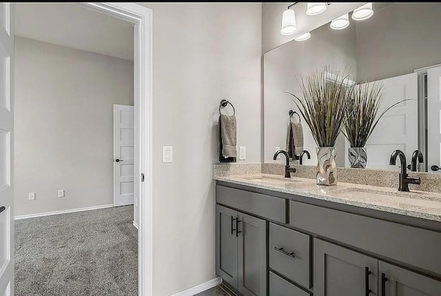 3921 Bandera Trl, Norman, OK 73071 - bathroom featuring double vanity and baseboards