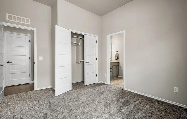 3921 Bandera Trl, Norman, OK 73071 - unfurnished bedroom with carpet, baseboards, a closet, and ensuite bath