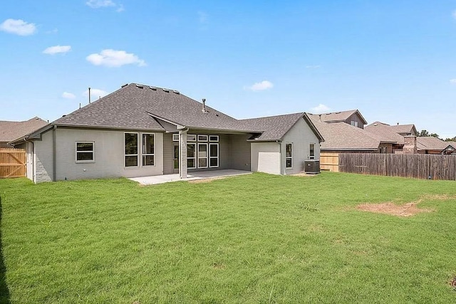 3921 Bandera Trl, Norman, OK 73071 - rear view of house with a patio, roof with shingles, and central AC