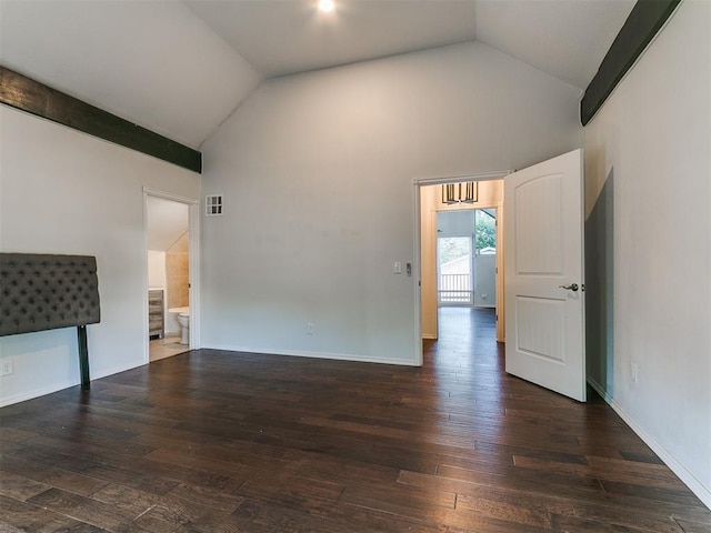 121 NW 27th St, Oklahoma City, OK 73103 - unfurnished living room with lofted ceiling, hardwood / wood-style floors, and baseboards