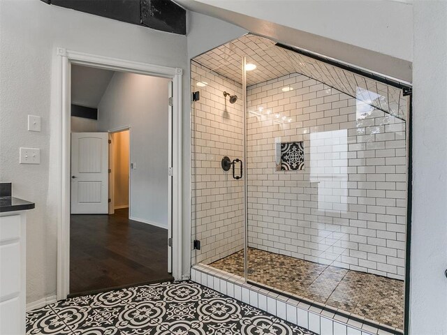 121 NW 27th St, Oklahoma City, OK 73103 - full bath with a stall shower and wood finished floors