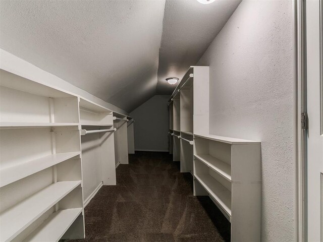 121 NW 27th St, Oklahoma City, OK 73103 - walk in closet featuring dark carpet and lofted ceiling