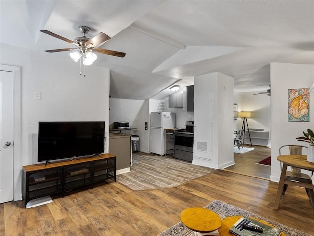 121 NW 27th St, Oklahoma City, OK 73103 - living area with a ceiling fan, light wood-type flooring, and baseboards