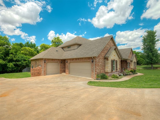13505 Shady Pine Cir, Edmond, OK 73025 - view of front of home featuring an attached garage, a shingled roof, a front lawn, brick siding, and concrete driveway