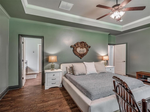 13505 Shady Pine Cir, Edmond, OK 73025 - bedroom with a raised ceiling, dark wood-style floors, crown molding, baseboards, and a ceiling fan