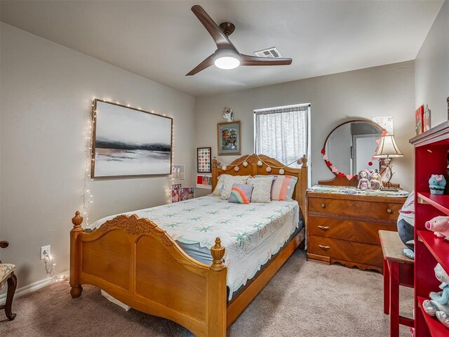 13505 Shady Pine Cir, Edmond, OK 73025 - bedroom featuring carpet flooring, a ceiling fan, and baseboards
