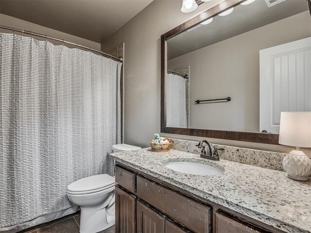 13505 Shady Pine Cir, Edmond, OK 73025 - full bathroom with vanity, toilet, tile patterned flooring, and a shower with shower curtain