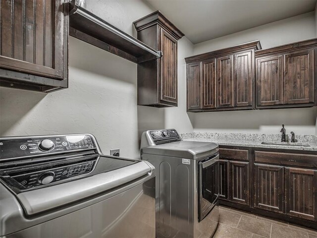 13505 Shady Pine Cir, Edmond, OK 73025 - laundry area featuring cabinet space and washing machine and clothes dryer