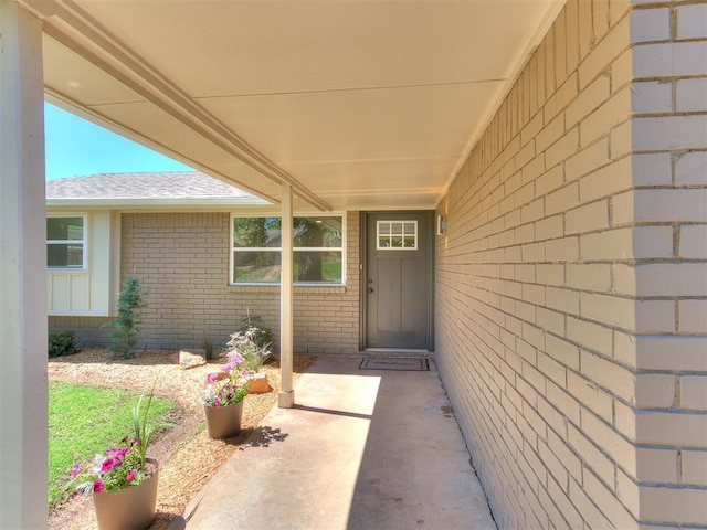 7624 NW 14th Ter, Oklahoma City, OK 73127 - entrance to property featuring brick siding and a shingled roof