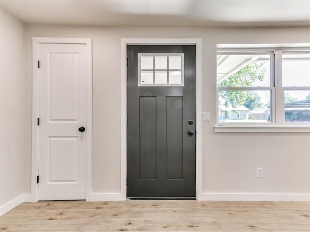 7624 NW 14th Ter, Oklahoma City, OK 73127 - foyer entrance with baseboards and wood finished floors