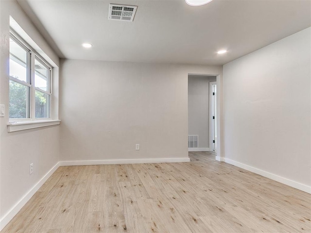 7624 NW 14th Ter, Oklahoma City, OK 73127 - spare room with wood finished floors, baseboards, and recessed lighting