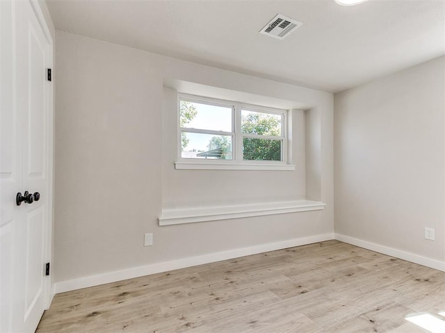 7624 NW 14th Ter, Oklahoma City, OK 73127 - spare room featuring wood finished floors and baseboards