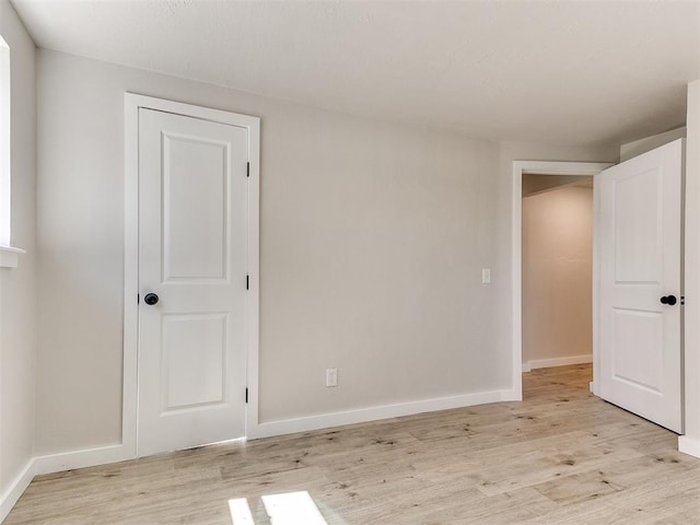7624 NW 14th Ter, Oklahoma City, OK 73127 - unfurnished room featuring light wood-style flooring and baseboards