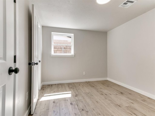 7624 NW 14th Ter, Oklahoma City, OK 73127 - unfurnished room with wood finished floors and baseboards