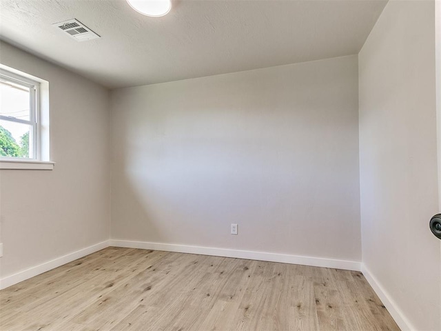7624 NW 14th Ter, Oklahoma City, OK 73127 - empty room featuring light wood finished floors and baseboards