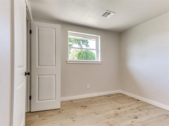 7624 NW 14th Ter, Oklahoma City, OK 73127 - spare room featuring light wood-type flooring and baseboards