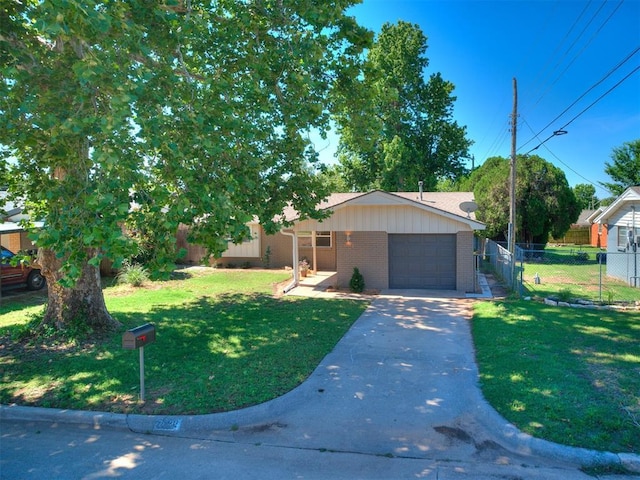 7624 NW 14th Ter, Oklahoma City, OK 73127 - view of front of property with an attached garage, brick siding, and concrete driveway