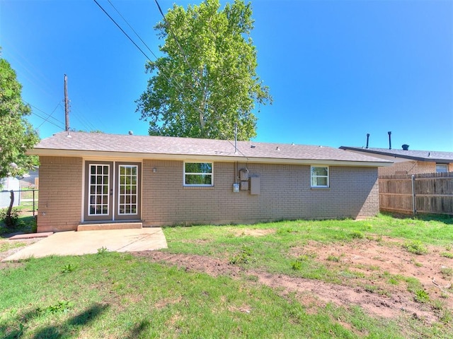 7624 NW 14th Ter, Oklahoma City, OK 73127 - rear view of property with brick siding and a patio area