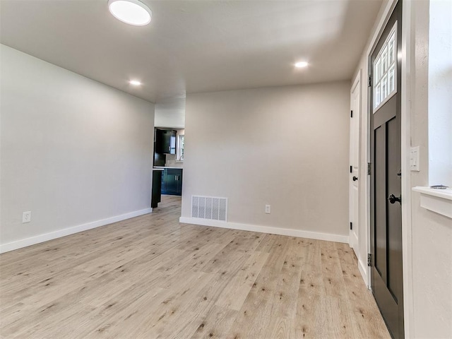7624 NW 14th Ter, Oklahoma City, OK 73127 - empty room with light wood-style floors and recessed lighting