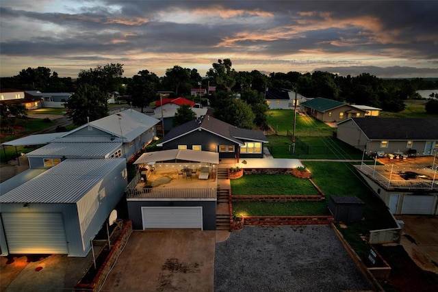 109 Cowan Ave, Fort Cobb, OK 73038 - aerial view at dusk of a residential view