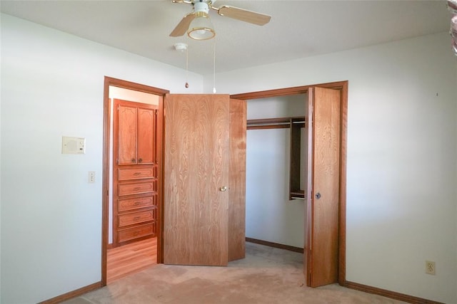 2313 SW 91st St, Oklahoma City, OK 73159 - unfurnished bedroom with light colored carpet, a closet, baseboards, and a ceiling fan