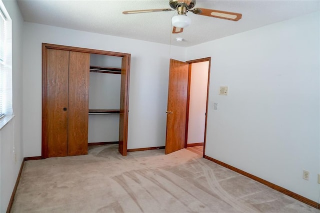 2313 SW 91st St, Oklahoma City, OK 73159 - unfurnished bedroom with a closet, carpet, baseboards, and a ceiling fan