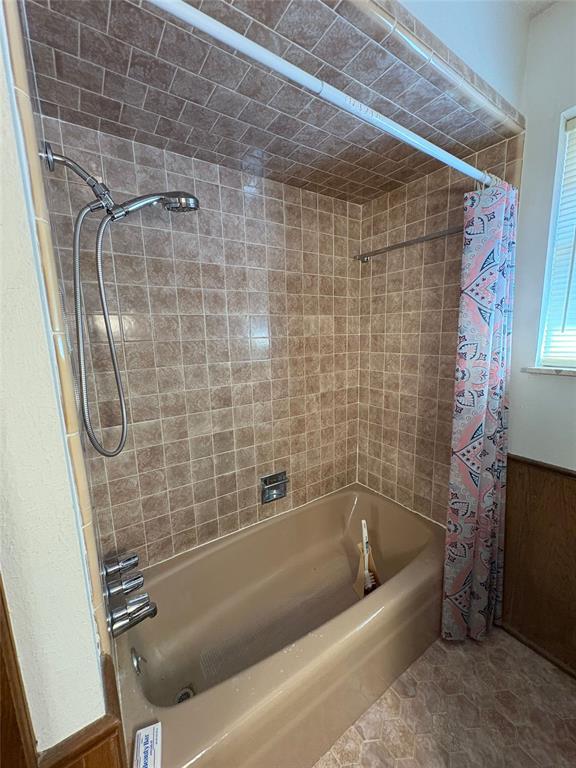 2313 SW 91st St, Oklahoma City, OK 73159 - bathroom with shower / bath combination with curtain